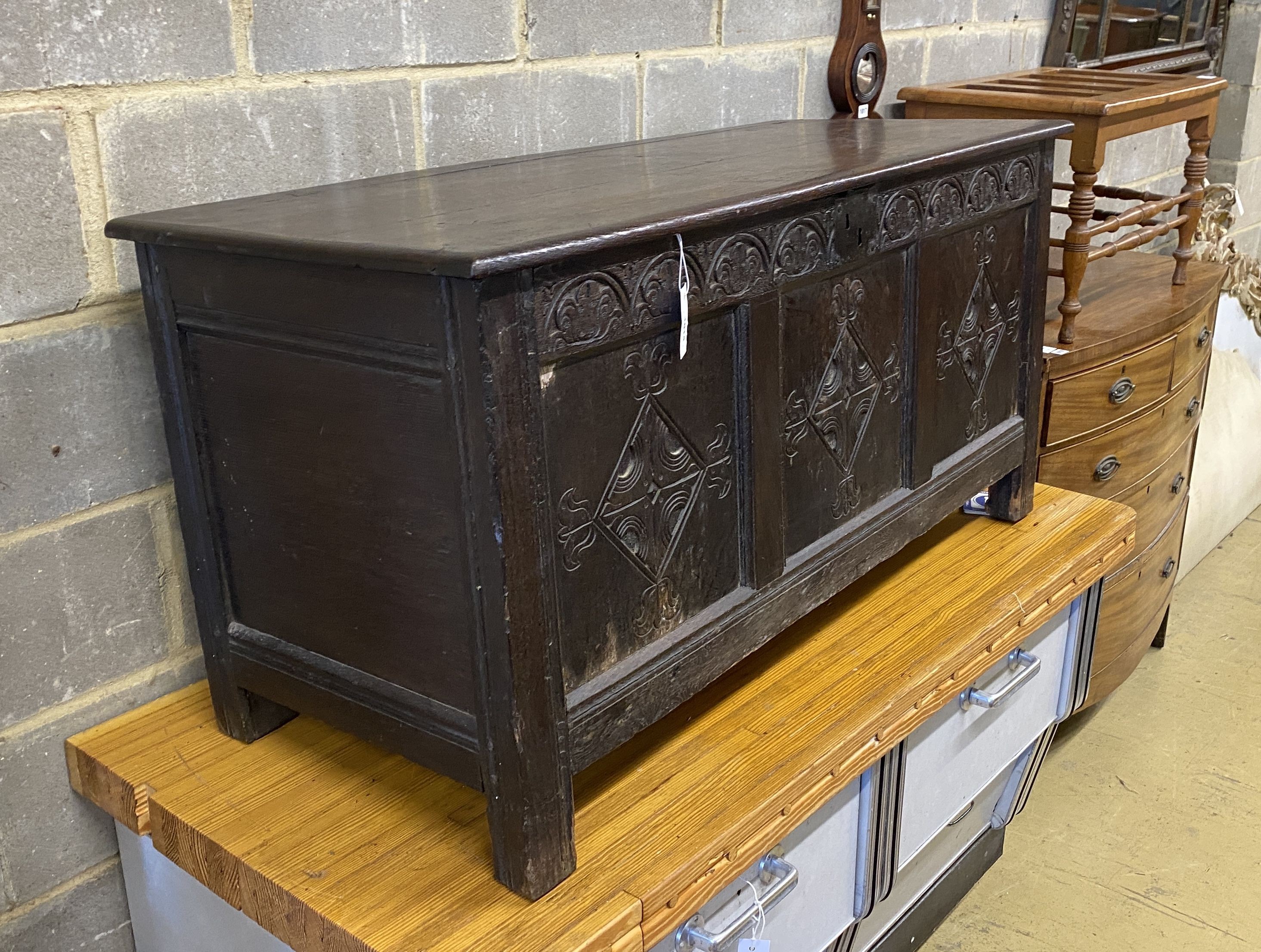 An 18th century and later carved oak coffer, length 130cm, depth 53cm, height 62cm